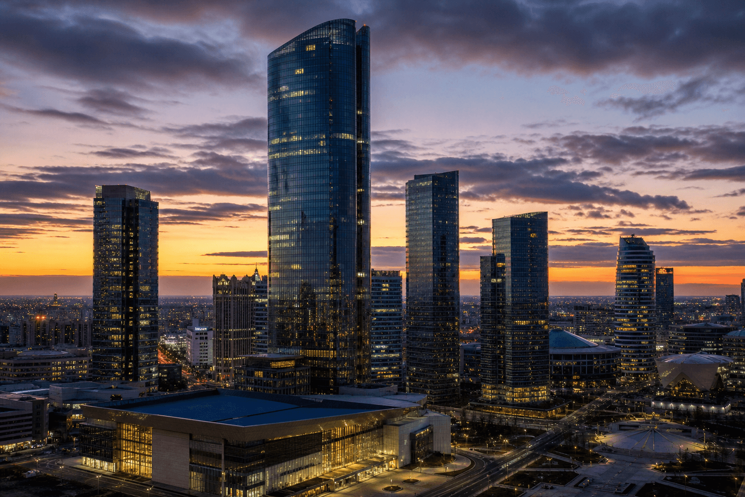 Astana's financial district at dusk — glass towers on the steppe.